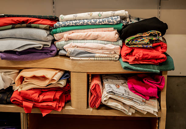 An image of a closet with stacked clothes