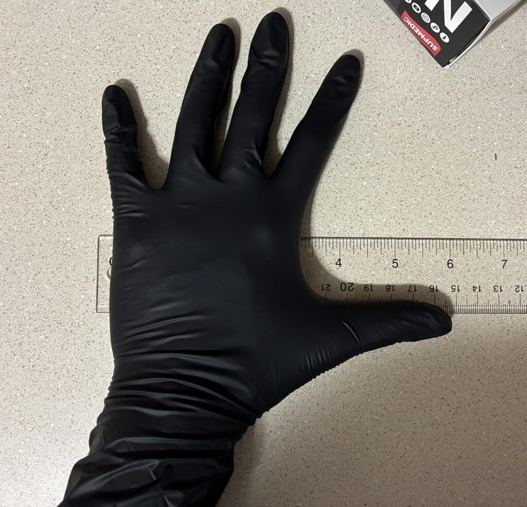 An image showing a disposable nitrile glove for bed bug inspection.